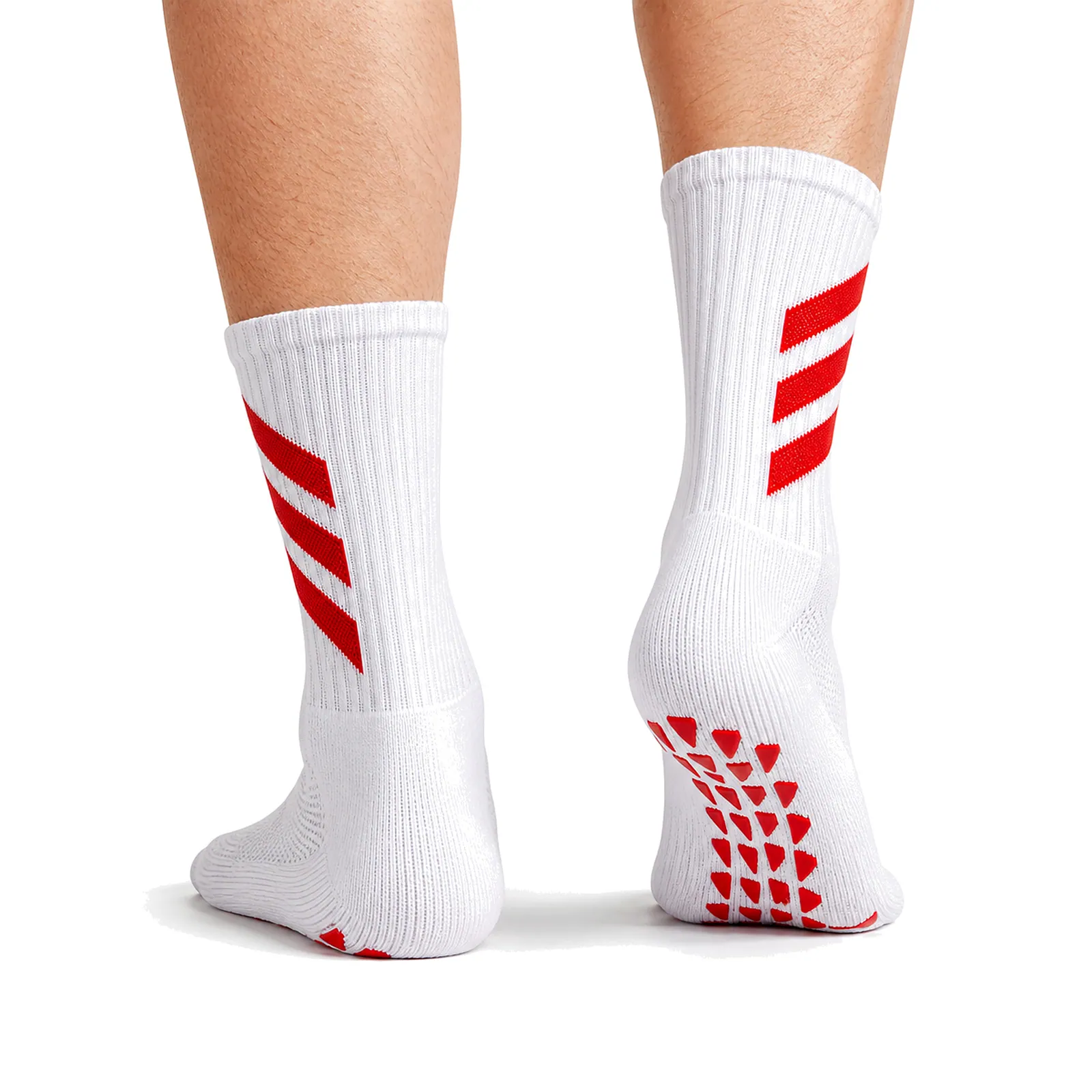 White crew socks with red calf stripes and red grip patterns on the sole