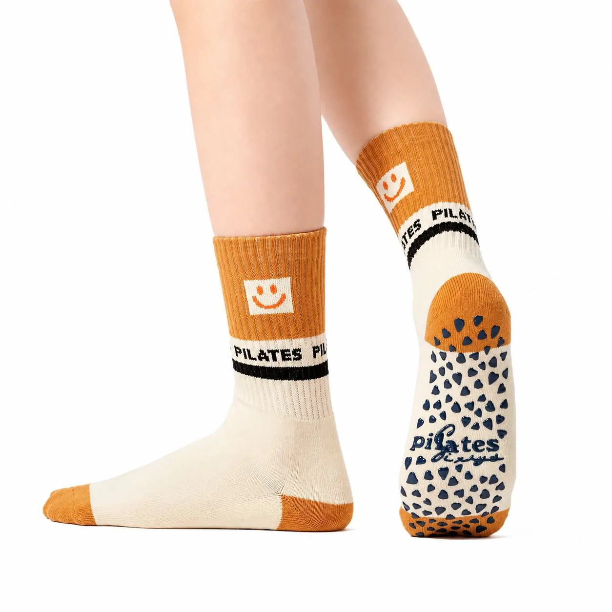 Cream and caramel Pilates socks with illustrated details and patterned soles